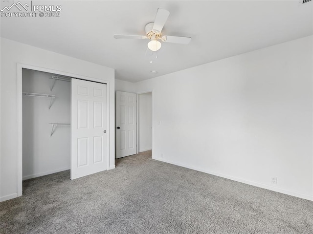 unfurnished bedroom featuring a closet, baseboards, ceiling fan, and carpet flooring