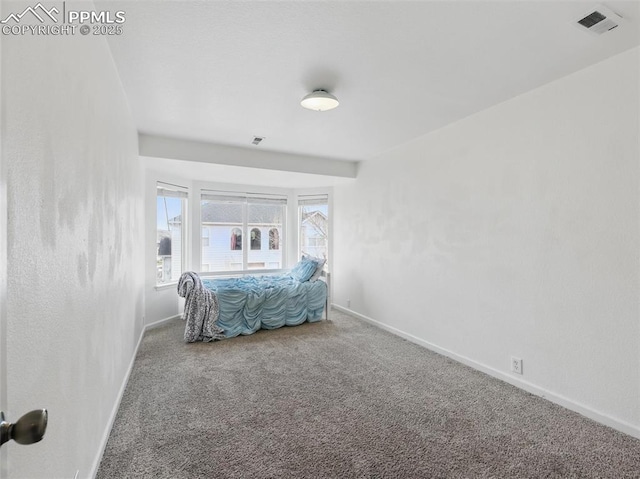 bedroom featuring carpet floors, baseboards, and visible vents