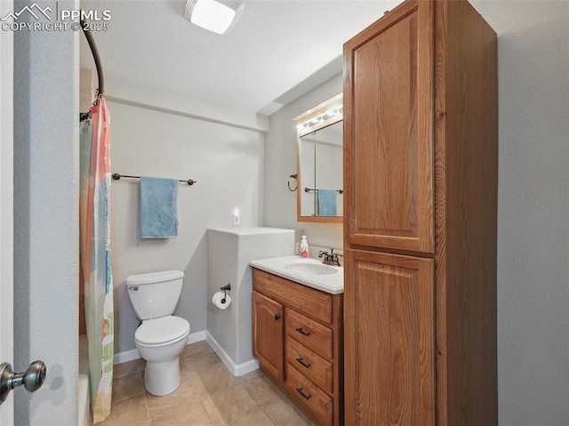 full bathroom featuring toilet, tile patterned floors, curtained shower, and vanity