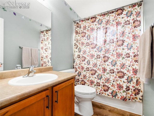 5346 Gentle Wind Rd, Colorado Springs, CO 80922 - bathroom featuring toilet, vanity, wood finished floors, and a shower with curtain