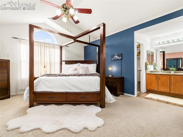 5346 Gentle Wind Rd, Colorado Springs, CO 80922 - bedroom with light carpet, lofted ceiling, baseboards, and connected bathroom