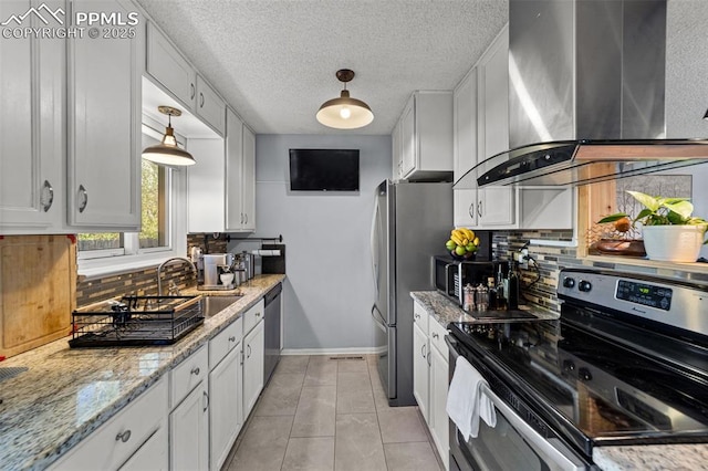 1065 N 19th St, Colorado Springs, CO 80904 - kitchen with white cabinets, a sink, wall chimney exhaust hood, stainless steel appliances, and decorative backsplash
