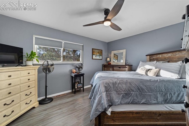 1065 N 19th St, Colorado Springs, CO 80904 - bedroom featuring ceiling fan, baseboards, visible vents, and wood finished floors