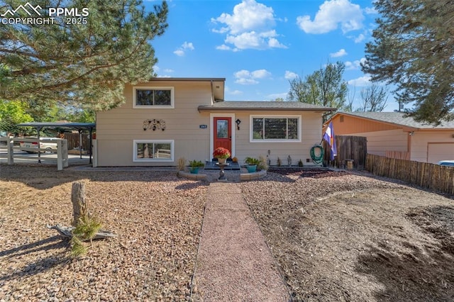 1065 N 19th St, Colorado Springs, CO 80904 - split level home featuring fence