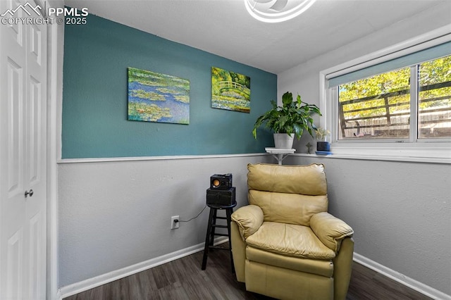 1065 N 19th St, Colorado Springs, CO 80904 - living area with baseboards and wood finished floors