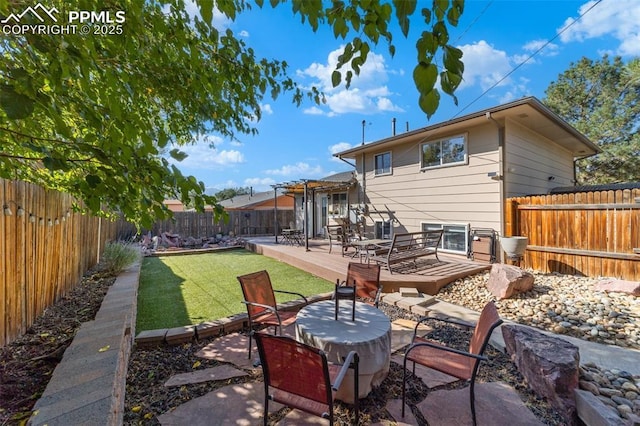 1065 N 19th St, Colorado Springs, CO 80904 - back of house featuring a yard, a deck, and a fenced backyard