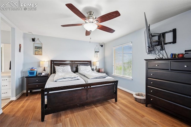 bedroom with baseboards, ceiling fan, and wood finished floors
