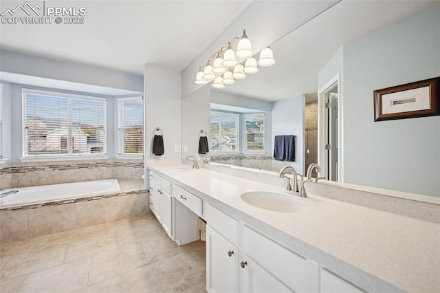 full bath with tile patterned flooring, a sink, a bath, and double vanity