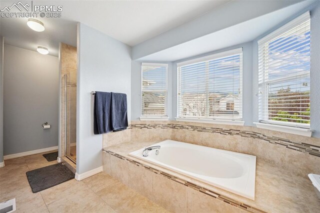 1483 W Costilla St, Colorado Springs, CO 80905 - full bathroom with visible vents, tile patterned flooring, a bath, and a wealth of natural light