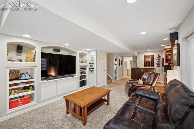 living room with light colored carpet, built in features, stairs, recessed lighting, and baseboards
