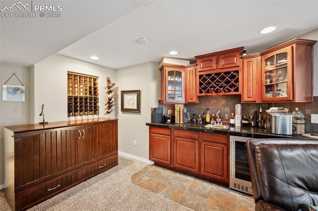 1483 W Costilla St, Colorado Springs, CO 80905 - bar with decorative backsplash, wine cooler, baseboards, recessed lighting, and wet bar
