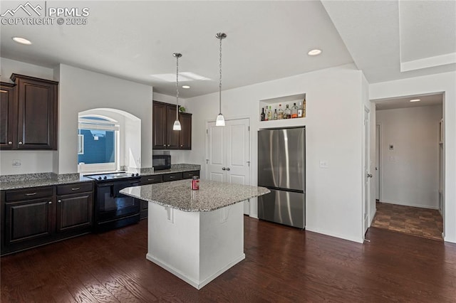 kitchen with dark wood-style flooring, dark brown cabinetry, recessed lighting, a kitchen island, and black appliances