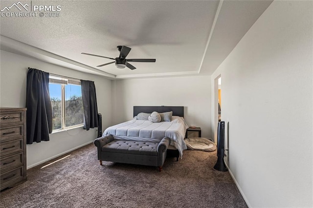 bedroom featuring baseboards, a ceiling fan, and dark carpet