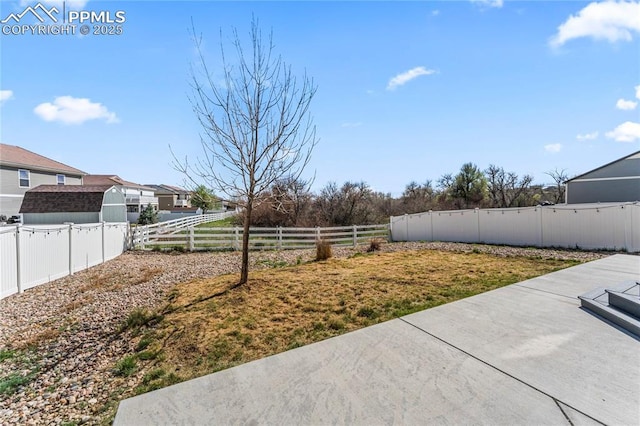 view of yard featuring a fenced backyard and a patio area