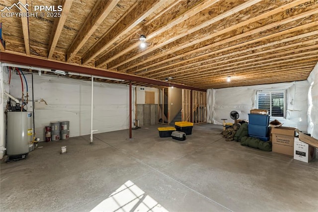 below grade area featuring water heater