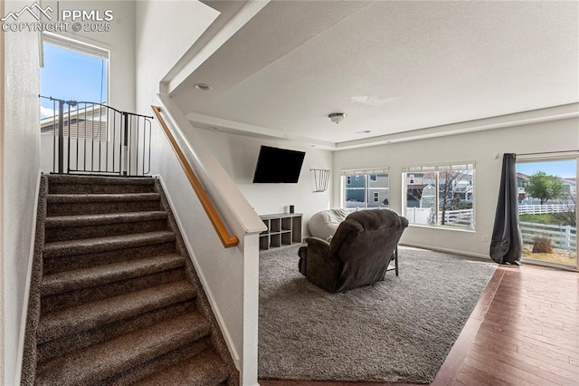 stairs featuring baseboards and wood finished floors