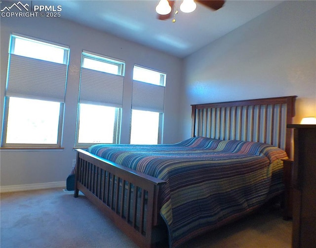 bedroom featuring carpet floors, a ceiling fan, and baseboards