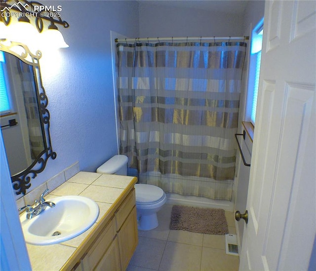 bathroom with tile patterned flooring, shower / tub combo with curtain, vanity, toilet, and visible vents