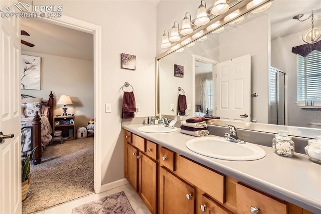 4338 Alder Springs Vw, Colorado Springs, CO 80922 - bathroom with double vanity, ensuite bathroom, and tile patterned flooring