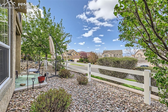 4338 Alder Springs Vw, Colorado Springs, CO 80922 - view of yard featuring fence, a residential view, and a patio