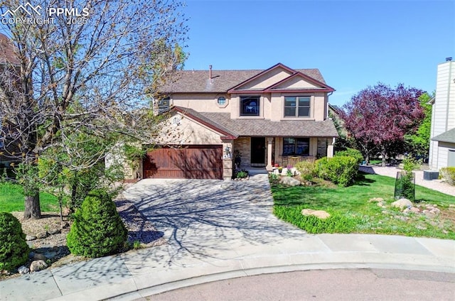 620 Coveglen Ct, Colorado Springs, CO 80906 - traditional home with a porch, a garage, concrete driveway, and a front lawn