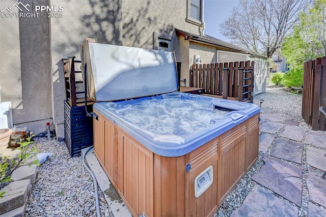 620 Coveglen Ct, Colorado Springs, CO 80906 - view of patio with a hot tub and fence