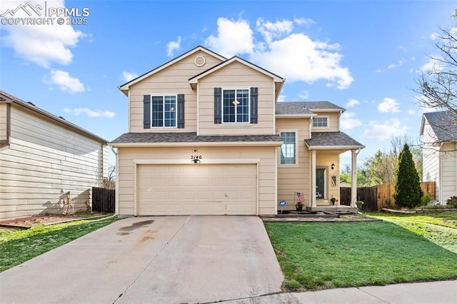 traditional home featuring an attached garage, concrete driveway, and roof with shingles