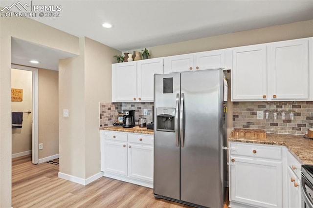 kitchen with stainless steel appliances, light wood finished floors, white cabinetry, and recessed lighting