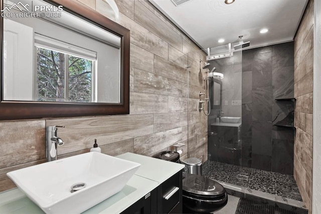 15 Newport Cir, Colorado Springs, CO 80906 - bathroom featuring vanity, toilet, recessed lighting, tile walls, and a stall shower