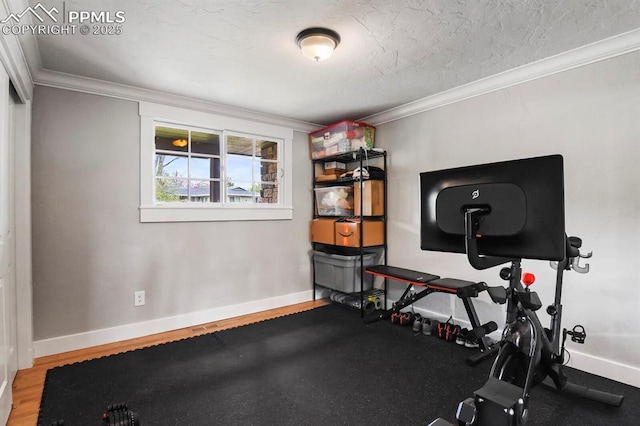 15 Newport Cir, Colorado Springs, CO 80906 - workout area featuring baseboards, ornamental molding, and wood finished floors