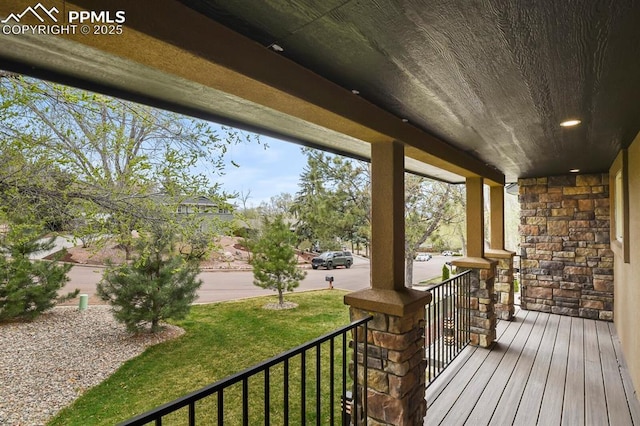 15 Newport Cir, Colorado Springs, CO 80906 - wooden terrace featuring covered porch