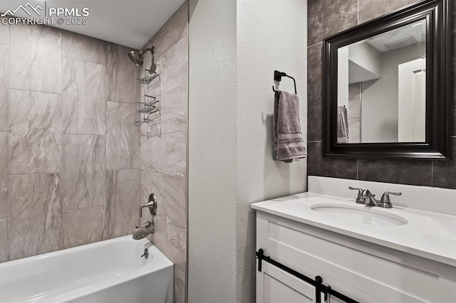 15 Newport Cir, Colorado Springs, CO 80906 - full bathroom featuring vanity, a textured wall, and shower / washtub combination