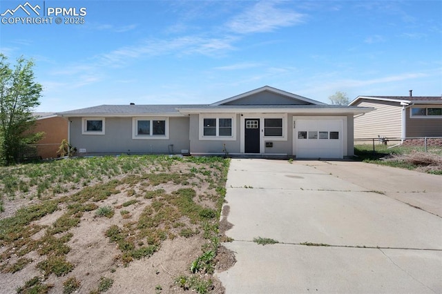 208 Davie Dr, Colorado Springs, CO 80911 - single story home with an attached garage, fence, stucco siding, and concrete driveway