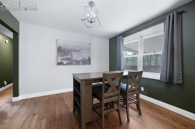 208 Davie Dr, Colorado Springs, CO 80911 - dining area featuring baseboards, dark wood finished floors, and a notable chandelier