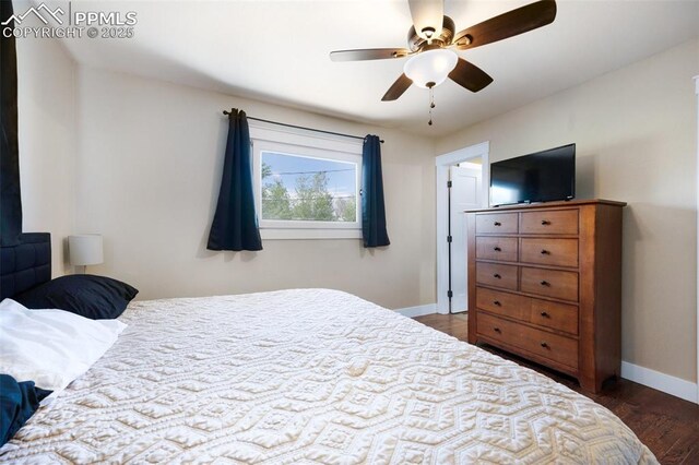 208 Davie Dr, Colorado Springs, CO 80911 - bedroom featuring dark wood-type flooring, a ceiling fan, and baseboards