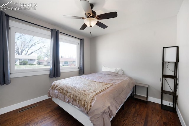 208 Davie Dr, Colorado Springs, CO 80911 - bedroom with baseboards, a ceiling fan, wood finished floors, and visible vents