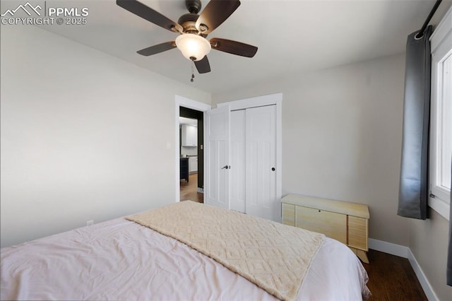 208 Davie Dr, Colorado Springs, CO 80911 - bedroom with baseboards, dark wood-style flooring, ceiling fan, and a closet