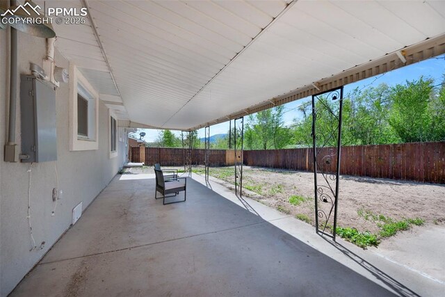 208 Davie Dr, Colorado Springs, CO 80911 - view of patio / terrace featuring fence and a carport