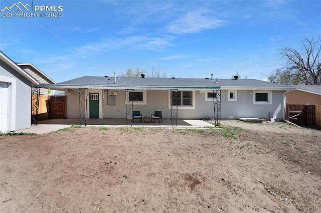 208 Davie Dr, Colorado Springs, CO 80911 - rear view of property with a patio, a gate, fence, and stucco siding