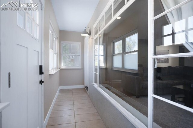 208 Davie Dr, Colorado Springs, CO 80911 - doorway featuring tile patterned floors and baseboards