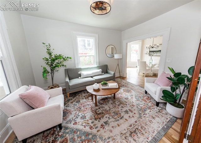 living room featuring baseboards and wood finished floors