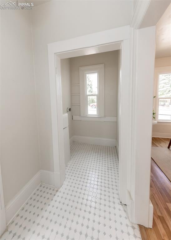 interior space featuring baseboards
