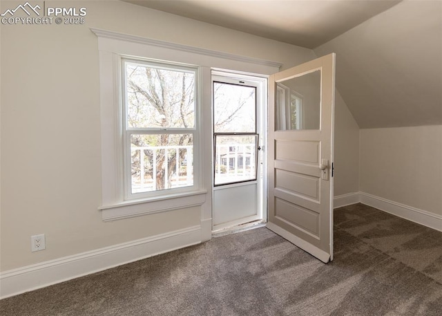 additional living space with carpet floors, baseboards, and vaulted ceiling