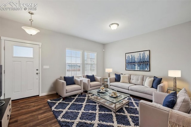 7318 Dutch Loop, Colorado Springs, CO 80925 - living area featuring dark wood-style flooring and baseboards