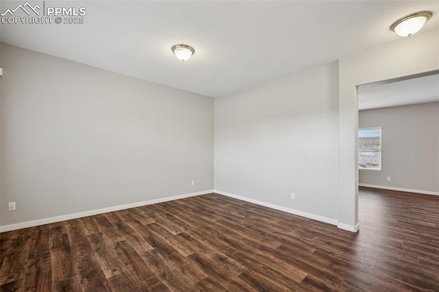 7318 Dutch Loop, Colorado Springs, CO 80925 - spare room with baseboards and dark wood-style floors