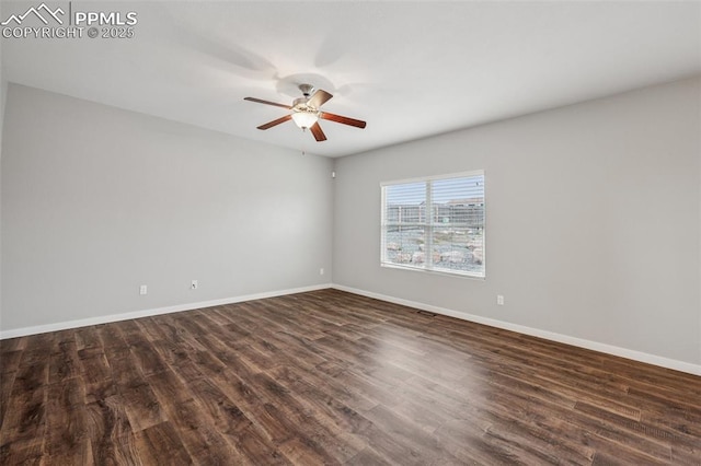 7318 Dutch Loop, Colorado Springs, CO 80925 - spare room featuring baseboards, a ceiling fan, and dark wood-style floors