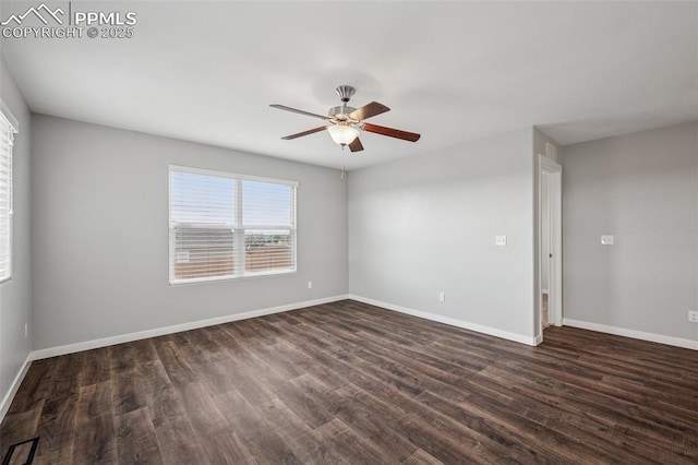 7318 Dutch Loop, Colorado Springs, CO 80925 - empty room with baseboards, a ceiling fan, and dark wood finished floors