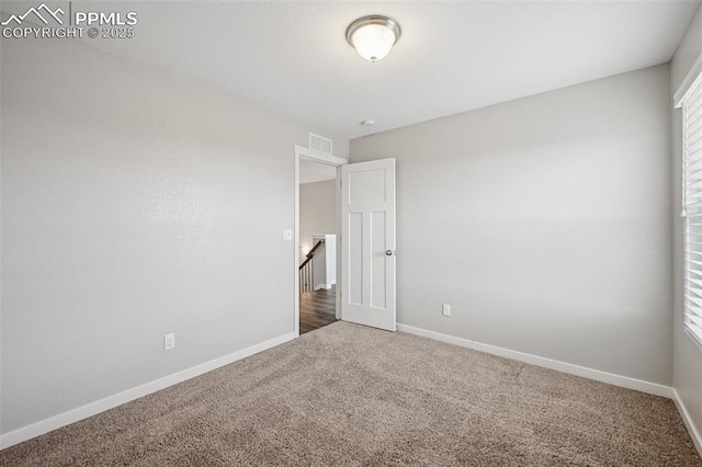 7318 Dutch Loop, Colorado Springs, CO 80925 - carpeted empty room featuring baseboards and visible vents