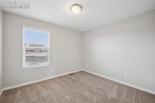7318 Dutch Loop, Colorado Springs, CO 80925 - empty room featuring visible vents, carpet, and baseboards