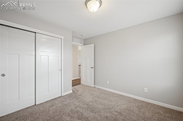 7318 Dutch Loop, Colorado Springs, CO 80925 - unfurnished bedroom with carpet floors, baseboards, a closet, and visible vents